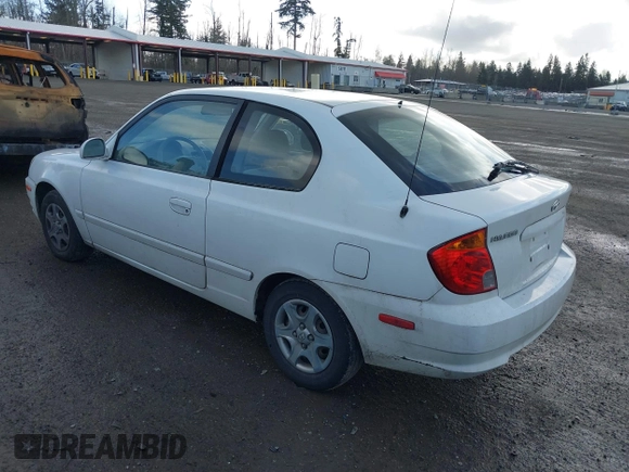 2004 Hyundai Accent GL with VIN KMHCG35C74U303431, listed as a IAAI auction lot 41725717 with 211,893 mi miles. Bid and sale history available at carsss.com. Image 3.