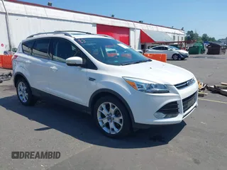 2016 Ford Escape Titanium z VIN 1FMCU9J97GUA75831, wystawiony jako IAAI lot #42421611 z przebiegiem 62 168 mil mil oraz . Historia ofert i sprzedaży dostępna na DreamBid. Obrazek 1.