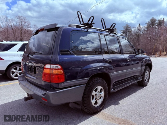 2002 Toyota Land Cruiser z VIN JTEHT05J622022972, wystawiony jako Copart lot #59201475 z przebiegiem 299 548 mil mil oraz Czysty tytuł • Clean title. Historia ofert i sprzedaży dostępna na DreamBid. Obrazek 4.