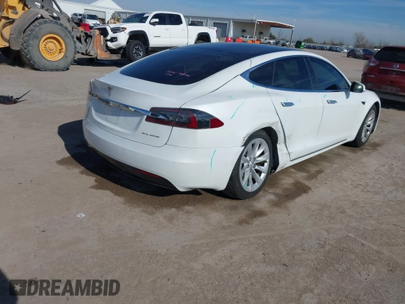 2020 Tesla Model S Long Range with VIN 5YJSA1E23LF360441, listed as a IAAI auction lot 41312865 with 68,967 mi miles and . Bid and sale history available at DreamBid. Image 4.