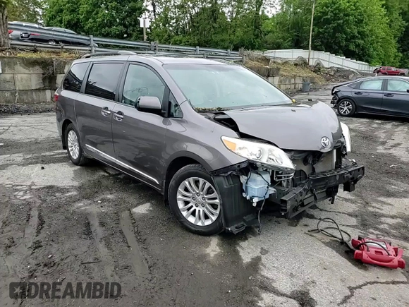 2015 Toyota Sienna XLE with VIN 5TDYK3DC4FS659692, listed as a Copart auction lot 57248355 with 121,644 mi miles and Salvage title. Bid and sale history available at DreamBid. Image 15.