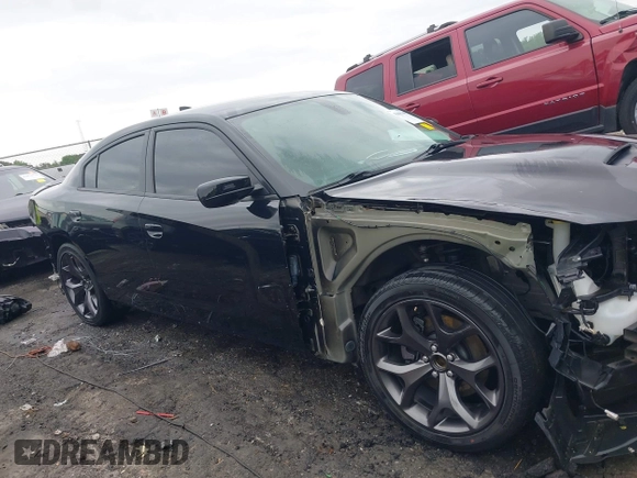 2018 Dodge Charger SXT Plus with VIN 2C3CDXHG0JH289216, listed as a IAAI auction lot 42085449 with 90,902 mi miles and . Bid and sale history available at DreamBid. Image 14.