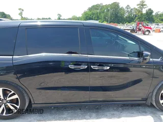 2018 Honda Odyssey Elite z VIN 5FNRL6H91JB109378, wystawiony jako IAAI lot #42270766 z przebiegiem 156 873 mil mil oraz . Historia ofert i sprzedaży dostępna na DreamBid. Obrazek 13.