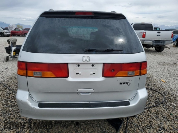 2004 Honda Odyssey EX-RES z VIN 5FNRL18804B121844, wystawiony jako Copart lot #53390135 z przebiegiem 284 065 mil mil oraz Szkoda całkowita • Salvage title. Historia ofert i sprzedaży dostępna na DreamBid. Obrazek 6.