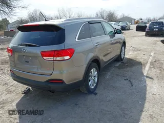 2017 Kia Sorento LX with VIN 5XYPG4A3XHG297598, listed as a IAAI auction lot 42029607 with 104,157 mi miles. Bid and sale history available at carsss.com. Image 4.