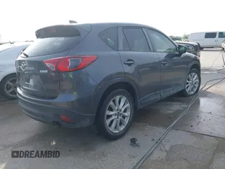 2014 Mazda CX-5 Grand Touring with VIN JM3KE2DY7E0345742, listed as a IAAI auction lot 41864116 with 158,746 mi miles. Bid and sale history available at carsss.com. Image 4.