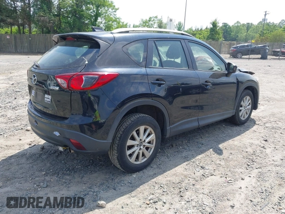 2014 Mazda CX-5 Sport with VIN JM3KE2BE3E0405976, listed as a IAAI auction lot 42161069 with 66,301 mi miles and . Bid and sale history available at carsss.com. Image 4.