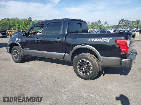2017 Nissan Titan Platinum Reserve with VIN 1N6AA1E53HN569660, listed as a Copart auction lot 54409625 with 98,858 mi miles and Salvage title. Bid and sale history available at DreamBid. Image 2.