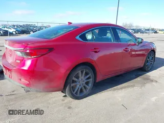 2016 Mazda 6 i Grand Touring with VIN JM1GJ1W51G1443203, listed as a IAAI auction lot 41247354 with 144,840 mi miles. Bid and sale history available at carsss.com. Image 4.