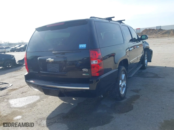 2011 Chevrolet Suburban LTZ with VIN 1GNSCKE03BR117338, listed as a IAAI auction lot 41878479 with 182,327 mi miles. Bid and sale history available at carsss.com. Image 4.