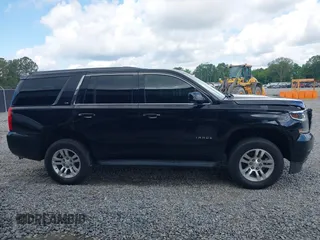 2015 Chevrolet Tahoe LS z VIN 1GNSCAKC5FR101933, wystawiony jako IAAI lot #42242415 z przebiegiem 185 191 mil mil oraz . Historia ofert i sprzedaży dostępna na DreamBid. Obrazek 13.