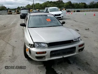 1999 Subaru Impreza L с VIN JF1GF4351XH815210, выставлен на аукционе Copart как лот 71250504 с пробегом 141 806 миль миль и Списание • Salvage title. История ставок и продаж доступна на DreamBid. Изображение 11.