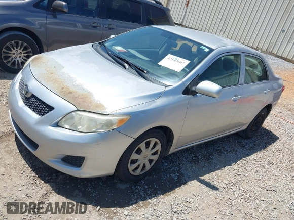 2009 Toyota Corolla with VIN JTDBL40E99J010861, listed as a IAAI auction lot 42143607 with 333,838 mi miles and . Bid and sale history available at DreamBid. Image 2.