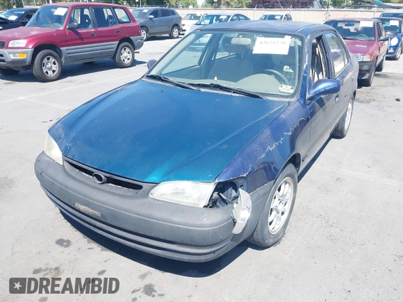 1998 Toyota Corolla VE z VIN 2T1BR18E4WC099280, wystawiony jako IAAI lot #42624278 z przebiegiem 129 901 mil mil oraz . Historia ofert i sprzedaży dostępna na DreamBid. Obrazek 6.