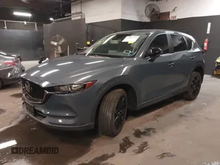 2021 Mazda CX-5 Touring with VIN JM3KFBCM5M0394707, listed as a IAAI auction lot 41887973 with 44,670 mi miles. Bid and sale history available at carsss.com. Image 19.