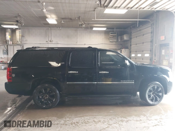 2010 Chevrolet Suburban LTZ with VIN 1GNUKKE39AR106851, listed as a IAAI auction lot 41994155 with 148,776 mi miles. Bid and sale history available at carsss.com. Image 13.