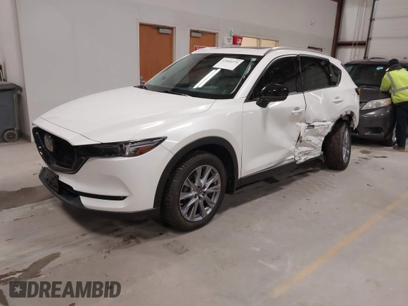 2020 Mazda CX-5 Grand Touring with VIN JM3KFBDM6L1828611, listed as a IAAI auction lot 42006976 with 59,939 mi miles and . Bid and sale history available at DreamBid. Image 18.