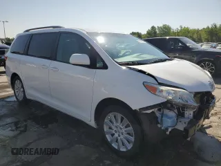 2015 Toyota Sienna LE with VIN 5TDJK3DC2FS126466, listed as a Copart auction lot 61165105 with 56,634 mi miles and Salvage title. Bid and sale history available at DreamBid. Image 4.