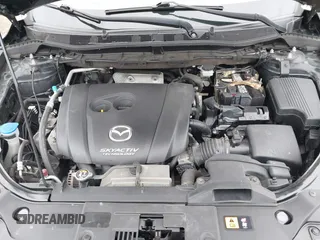 2016 Mazda CX-5 Sport with VIN JM3KE2BY4G0761933, listed as a IAAI auction lot 41709274 with 131,127 mi miles. Bid and sale history available at carsss.com. Image 10.