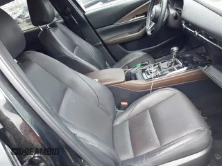 2022 Mazda CX-30 S Premium with VIN 3MVDMBDL5NM413878, listed as a IAAI auction lot 42189008 with 46,249 mi miles and . Bid and sale history available at DreamBid. Image 5.