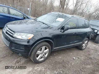 2012 Volkswagen Touareg Sport with VIN WVGFK9BP7CD002243, listed as a IAAI auction lot 41863765 with 136,231 mi miles and . Bid and sale history available at DreamBid. Image 18.
