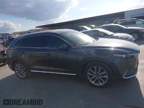 2016 Mazda CX-9 Grand Touring with VIN JM3TCADY8G0114940, listed as a IAAI auction lot 40701187 with 112,311 mi miles and . Bid and sale history available at DreamBid. Image 13.