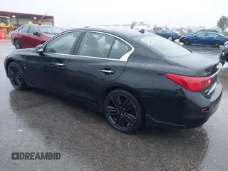 2015 Infiniti Q50 Premium z VIN JN1BV7ARXFM412382, wystawiony jako IAAI lot #40776813 z przebiegiem 66 406 mil mil oraz . Historia ofert i sprzedaży dostępna na DreamBid. Obrazek 3.