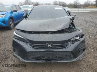 2024 Honda Civic Touring z VIN 2HGFE1F97RH316075, wystawiony jako Copart lot #50006805 z przebiegiem Nie podano mil oraz Szkoda całkowita • Salvage title. Historia ofert i sprzedaży dostępna na DreamBid. Obrazek 5.