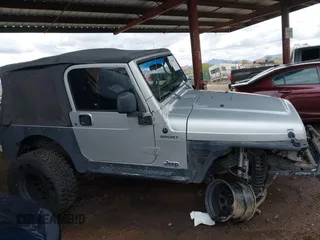 2006 Jeep Wrangler Sport with VIN 1J4FA49S46P748604, listed as a IAAI auction lot 41788157 with 128,249 mi miles. Bid and sale history available at carsss.com. Image 13.