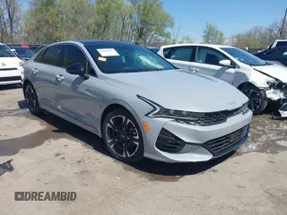 2023 Kia K5 GT-Line z VIN 5XXG64J25PG180895, wystawiony jako IAAI lot #41969085 z przebiegiem 31 590 mil mil oraz . Historia ofert i sprzedaży dostępna na DreamBid. Obrazek 1.