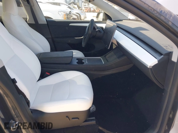 2023 Tesla Model Y Long Range with VIN 7SAYGDEE1PA203937, listed as a IAAI auction lot 41814421 with 9,138 mi miles. Bid and sale history available at carsss.com. Image 5.
