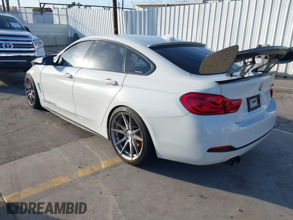 2018 BMW 4 Series 430i with VIN WBA4J1C59JBG77470, listed as a IAAI auction lot 41534689 with 141,710 mi miles and . Bid and sale history available at carsss.com. Image 3.