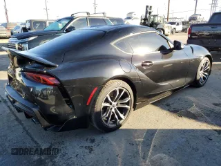 2022 Toyota GR Supra 2.0 with VIN WZ1DB2C08NW047883, listed as a Copart auction lot 84032614 with 26,907 mi miles and Salvage Title. Bid and sale history available at carsss.com. Image 3.