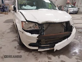 2012 Dodge Grand Caravan SXT with VIN 2C4RDGCG3CR405373, listed as a IAAI auction lot 41264407 with 164,019 mi miles and . Bid and sale history available at DreamBid. Image 6.