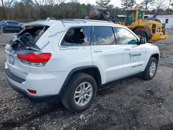 2018 Jeep Grand Cherokee Laredo E with VIN 1C4RJFAG8JC424609, listed as a IAAI auction lot 41124689 with 101,643 mi miles. Bid and sale history available at carsss.com. Image 4.