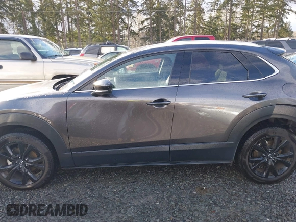 2021 Mazda CX-30 Premium with VIN 3MVDMBDY2MM239231, listed as a IAAI auction lot 41655159 with 22,679 mi miles and . Bid and sale history available at carsss.com. Image 15.