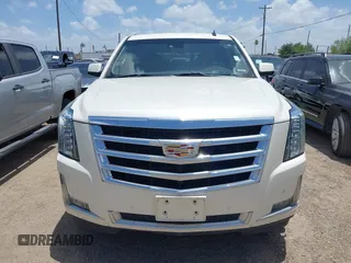 2015 Cadillac Escalade Luxury z VIN 1GYS4BKJ1FR215223, wystawiony jako IAAI lot #42548931 z przebiegiem 145 947 mil mil oraz . Historia ofert i sprzedaży dostępna na DreamBid. Obrazek 6.