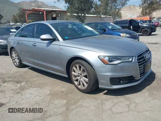 2016 Audi A6 3.0T Premium Plus with VIN WAUFGAFC4GN159496, listed as a IAAI auction lot 41885413 with 94,243 mi miles. Bid and sale history available at carsss.com. Image 1.