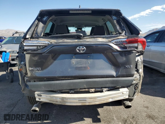 2020 Toyota RAV4 XLE with VIN 2T3W1RFV8LW070246, listed as a Copart auction lot 65072185 with 61,339 mi miles and Salvage title. Bid and sale history available at DreamBid. Image 6.