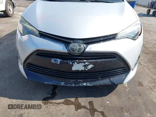 2018 Toyota Corolla L with VIN 5YFBURHEXJP810003, listed as a IAAI auction lot 42526648 with 84,546 mi miles and . Bid and sale history available at DreamBid. Image 6.