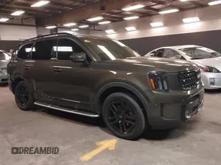 2024 Kia Telluride SX Prestige X-Line z VIN 5XYP5DGC0RG421909, wystawiony jako IAAI lot #42298822 z przebiegiem 26 073 mil mil oraz . Historia ofert i sprzedaży dostępna na DreamBid. Obrazek 1.