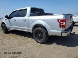 2018 Ford F-150 XL with VIN 1FTEW1CGXJFB40297, listed as a Copart auction lot 69642404 with 92,561 mi miles and Salvage title. Bid and sale history available at DreamBid. Image 2.