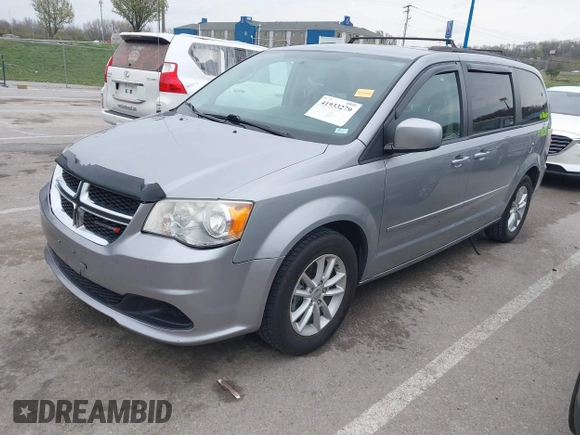 2014 Dodge Grand Caravan SXT with VIN 2C4RDGCG0ER417662, listed as a IAAI auction lot 41933279 with 156,751 mi miles and . Bid and sale history available at DreamBid. Image 2.