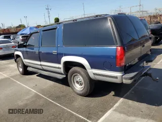 1997 GMC Suburban with VIN 1GKGK26J7VJ748464, listed as a Copart auction lot 52597135 with 176,109 mi miles and Salvage Title. Bid and sale history available at carsss.com. Image 2.