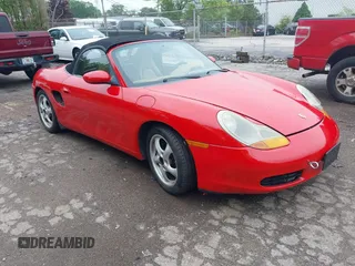 1999 Porsche Boxster z VIN WP0CA298XXU627841, wystawiony jako IAAI lot #42279335 z przebiegiem 124 949 mil mil oraz . Historia ofert i sprzedaży dostępna na DreamBid. Obrazek 1.