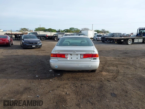 2000 Toyota Camry LE z VIN JT2BF28K6Y0282836, wystawiony jako IAAI lot #41799376 z przebiegiem 210 710 mil mil oraz . Historia ofert i sprzedaży dostępna na DreamBid. Obrazek 16.