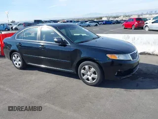 2009 Kia Optima LX with VIN KNAGE228895356658, listed as a IAAI auction lot 41580009 with 216,534 mi miles. Bid and sale history available at carsss.com. Image 1.
