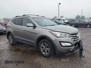 2016 Hyundai Santa Fe z VIN 5XYZUDLB2GG311580, wystawiony jako IAAI lot #42253876 z przebiegiem 163 639 mil mil oraz . Historia ofert i sprzedaży dostępna na DreamBid. Obrazek 1.