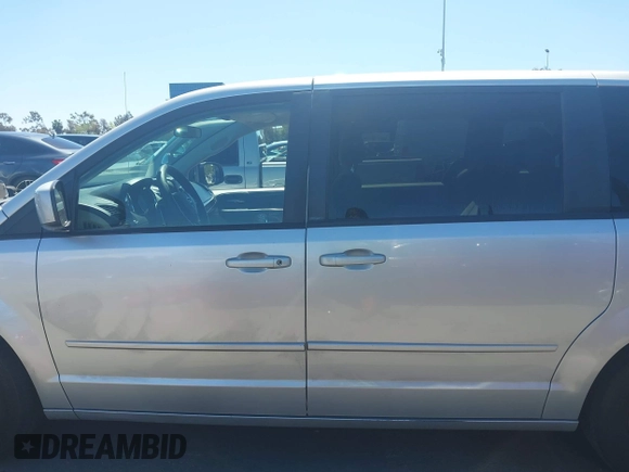 2012 Dodge Grand Caravan SXT with VIN 2C4RDGCG7CR204835, listed as a IAAI auction lot 41948688 with 125,466 mi miles and . Bid and sale history available at DreamBid. Image 14.