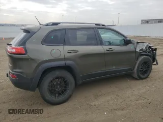 2015 Jeep Cherokee Trailhawk with VIN 1C4PJMBS0FW678738, listed as a Copart auction lot 50651235 with 147,793 mi miles and Salvage title. Bid and sale history available at DreamBid. Image 3.
